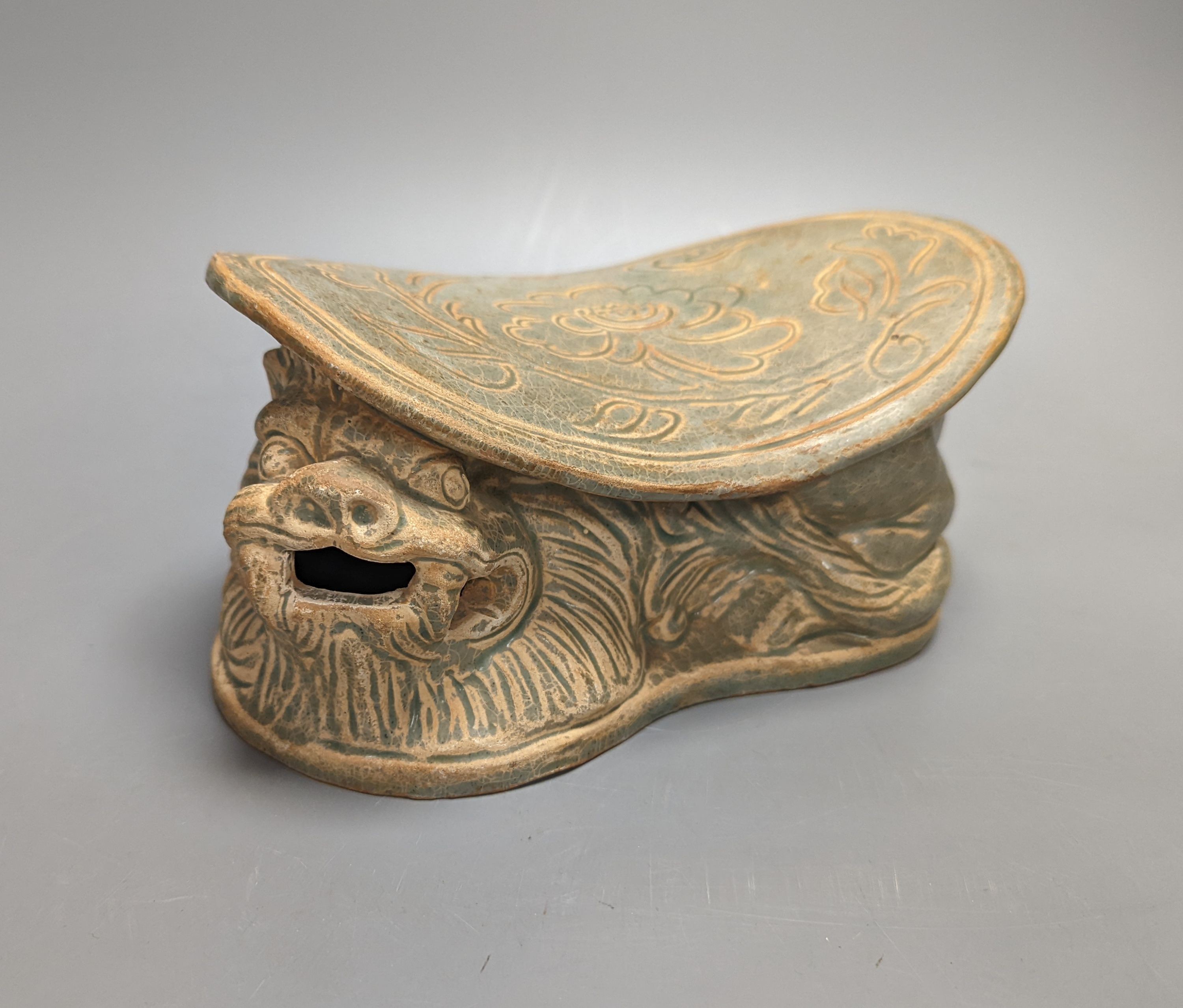 A Chinese celadon glazed pillow, width 20cm